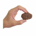 Hand holding a Beef Coconut Cookie dog treat against a white background
